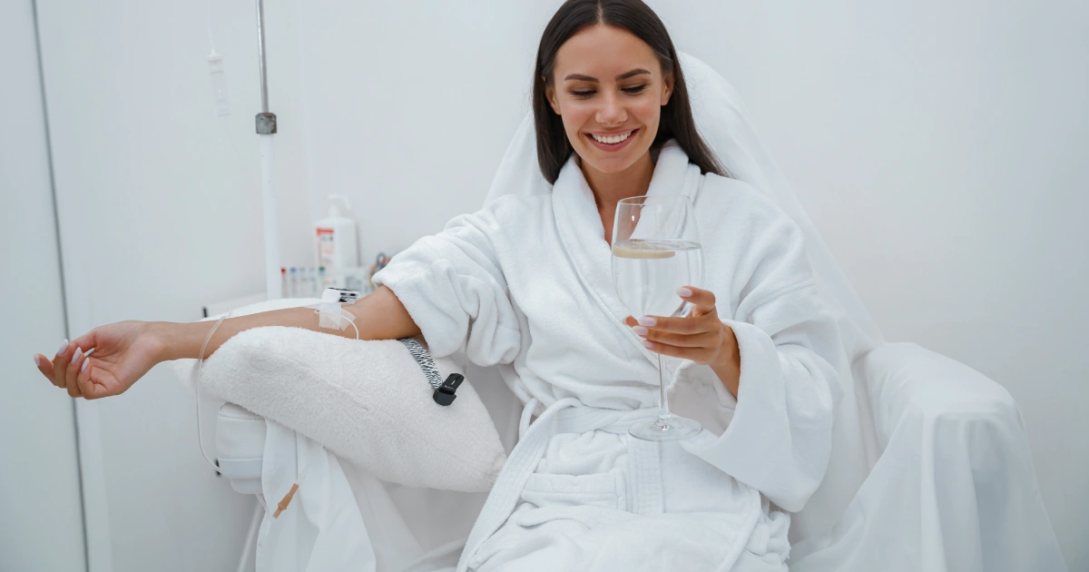 Patient undergoing IV infusion therapy session for wellness support